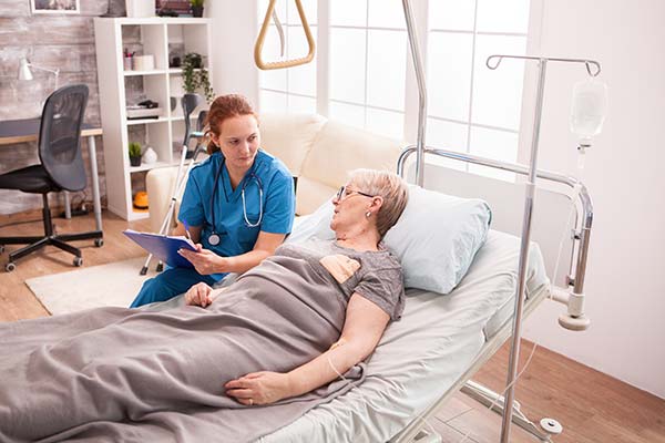 senior-woman-lying-in-nursing-home-bed-2022-02-02-03-56-34-utc